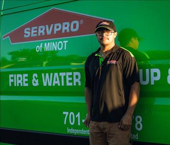 Employee photo taken in front of SERVPRO background