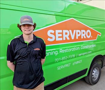 Employee photo taken in front of SERVPRO background