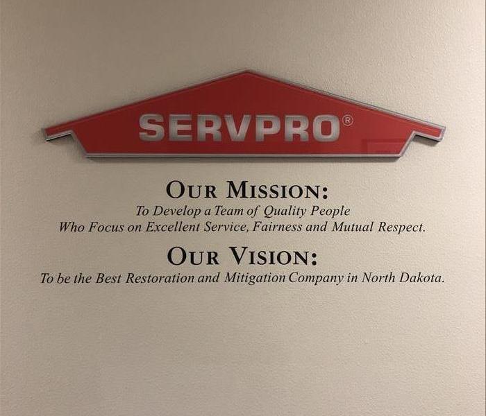 SERVPRO Logo on wall with mission statement and vision